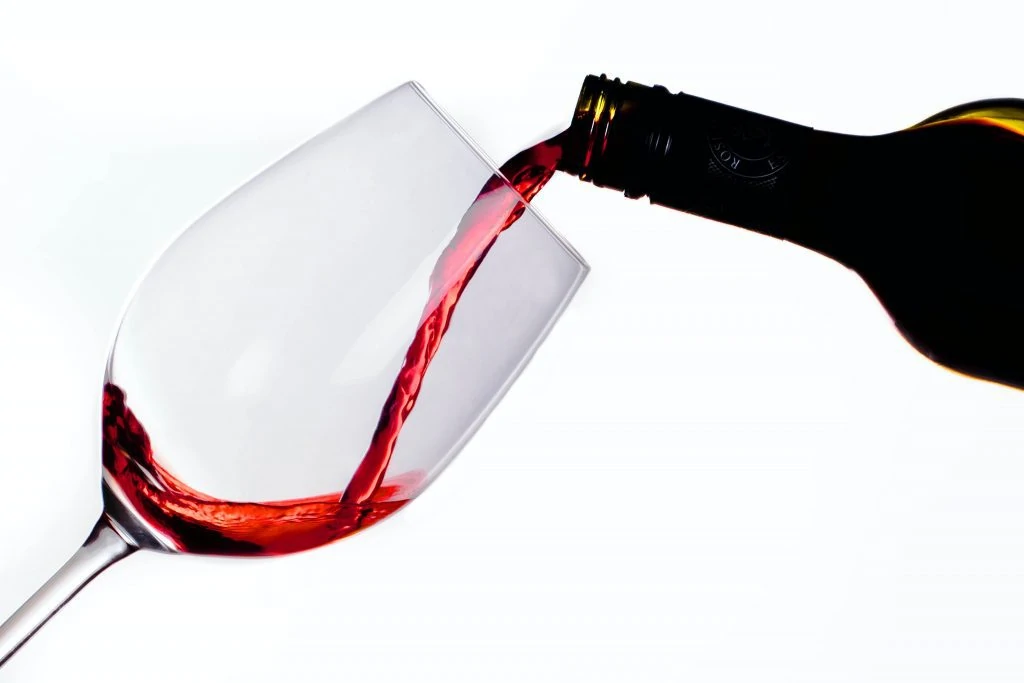 pouring red wine - shiraz cabernet featured image
