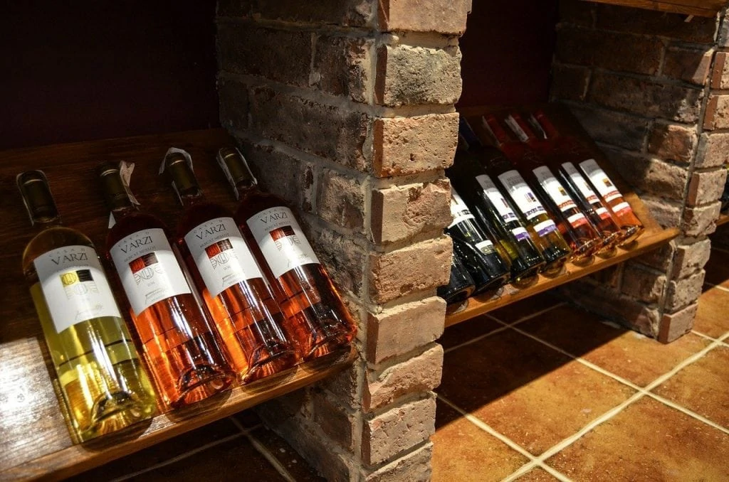 wine bottles on old fashioned racks - featured image